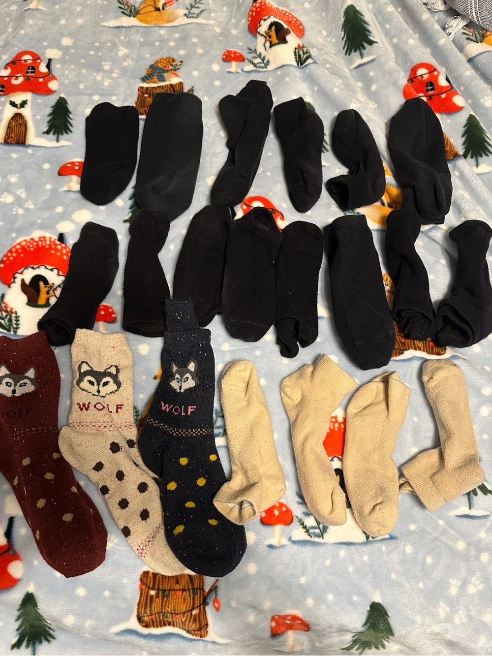 21 pairs of lightly worn socks — varying fabrics.